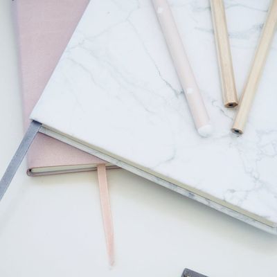 Clean desk surface with a single notebook