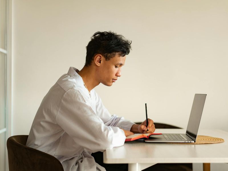 Person looking into the distance in a bright minimalist room